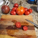 Fresh garden tomatoes on cutting board